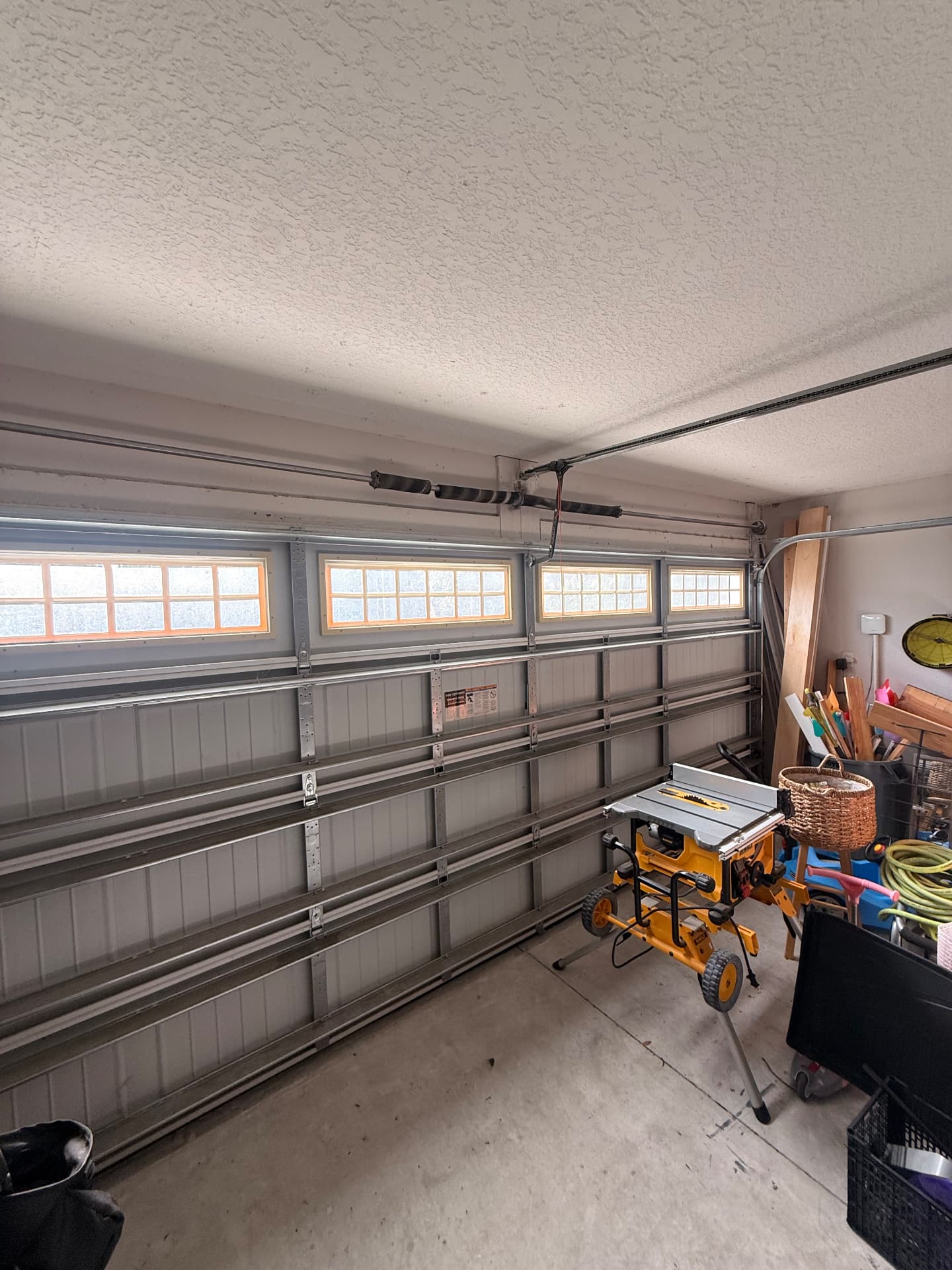 Broken garage door torsion spring before replacement